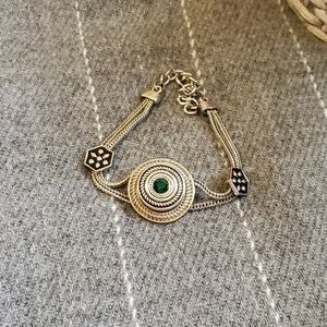 silver bracelet with emerald stone